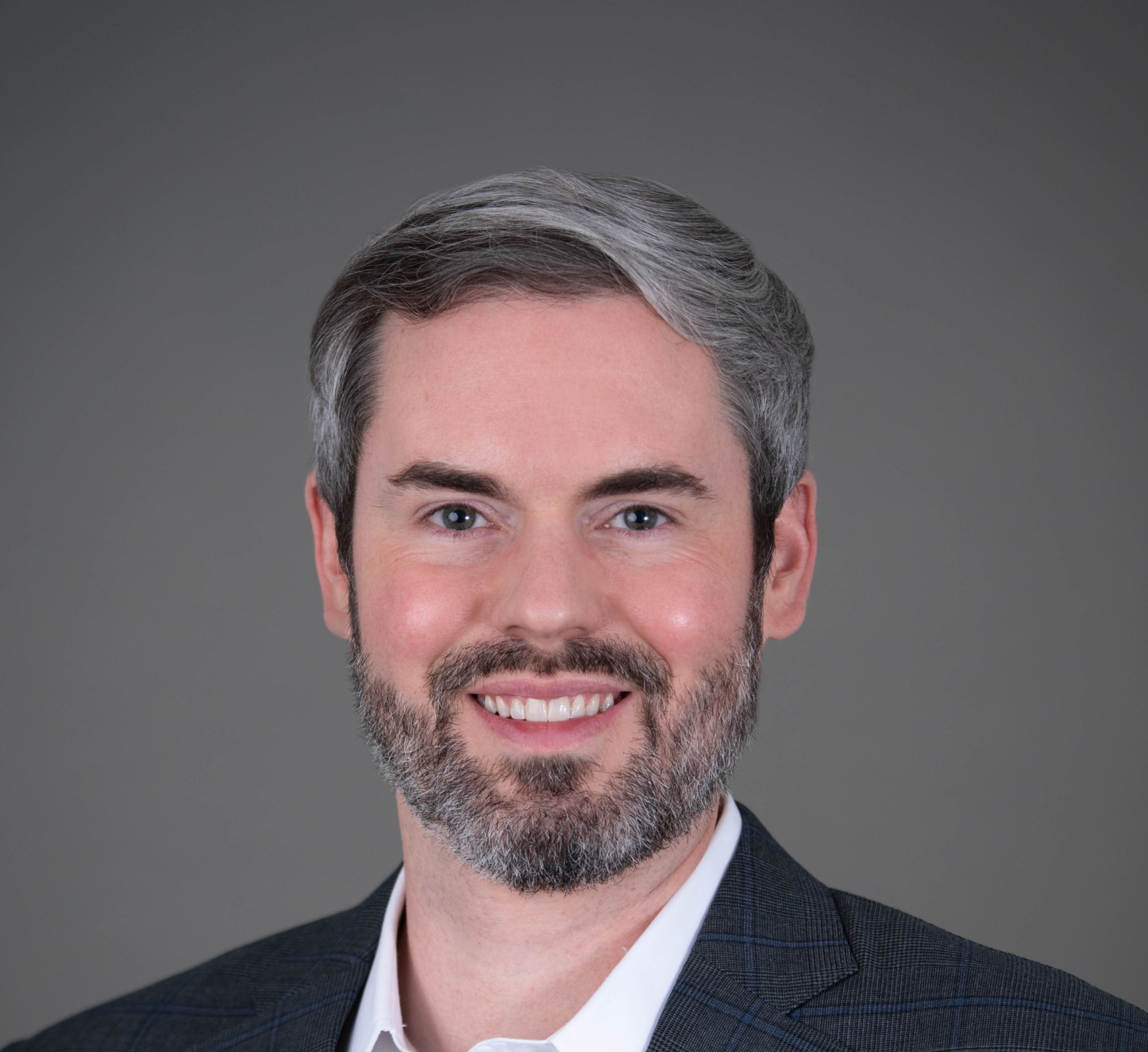 Adam Headshot (No tie) (1).jpg